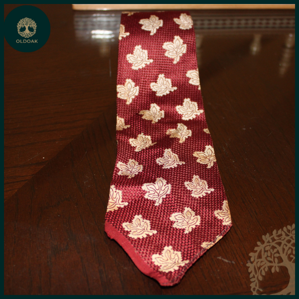 Regal Scarlet: Textured Red Tie Adorned with White Leaf Motif